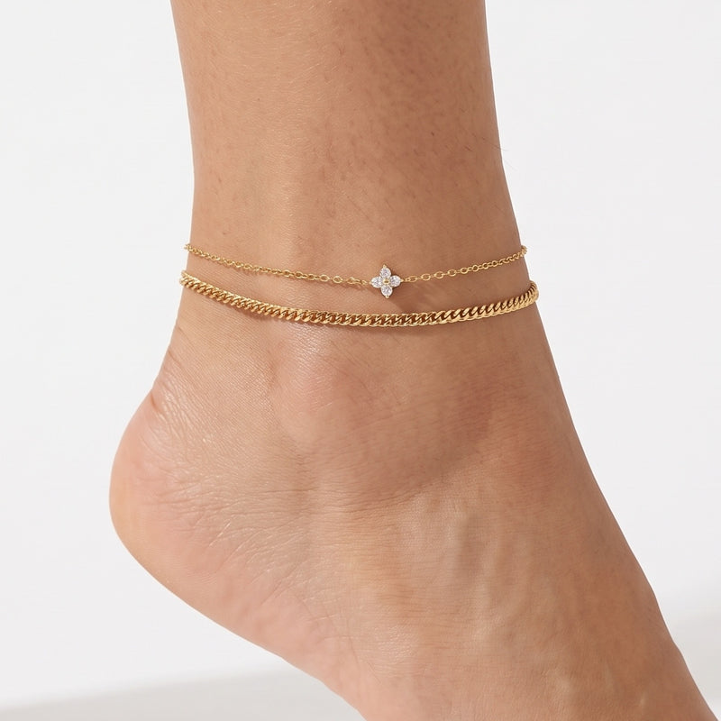 Close-up of the Lelice Noelle Layered Anklet Set in gold on a woman's ankle