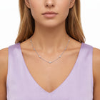 Close-up of the Lelice Nora Zircon Necklace in silver at the collarbone