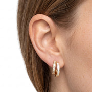 Close-up of the Lelice Odette Pearl Earrings in gold on the ear