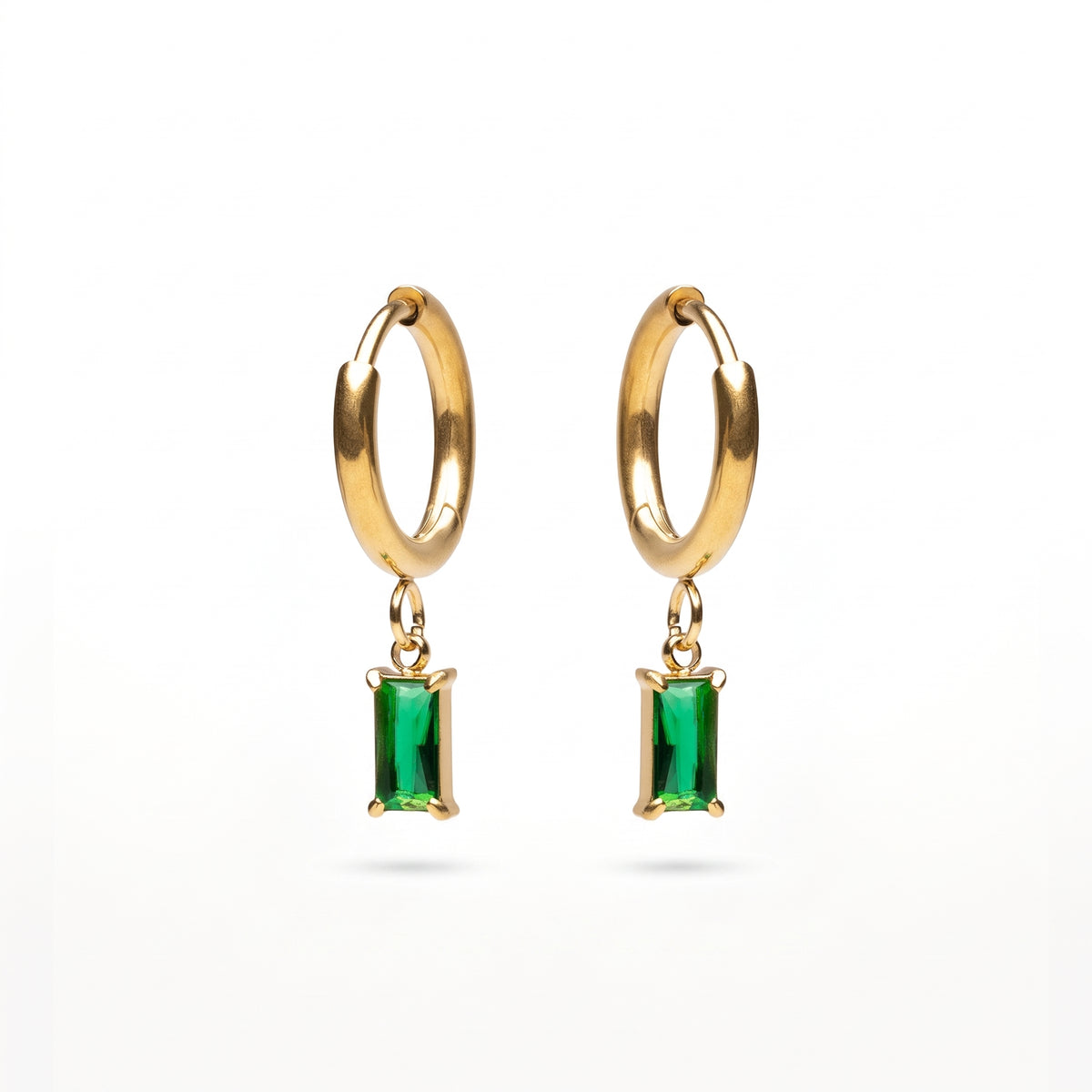 Lelice Piper Emerald Earrings in gold on a white background