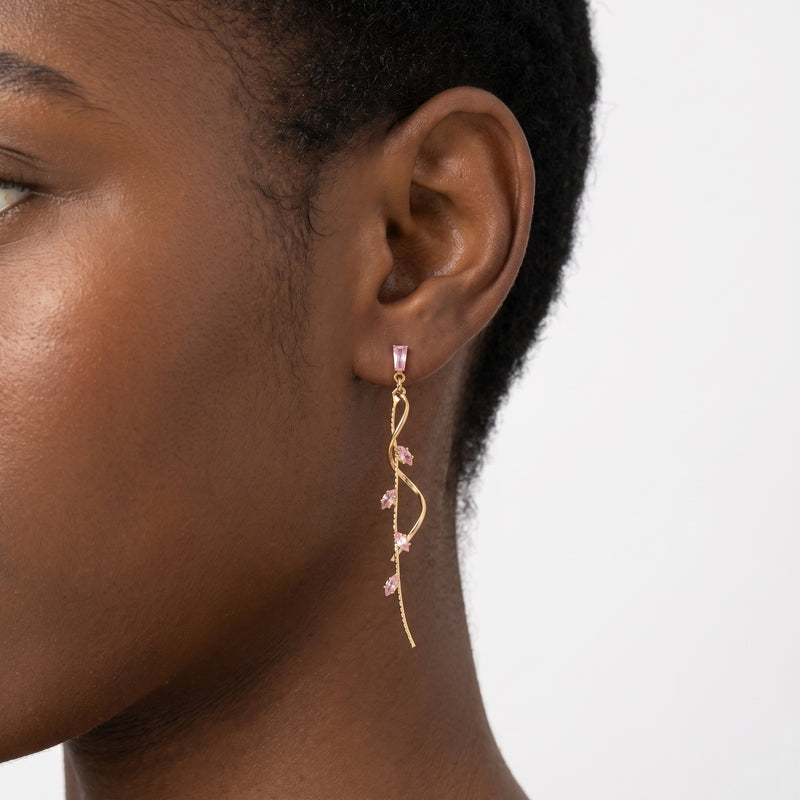 Close-up of the Lelice Santorini Blush Drops in gold on the ear
