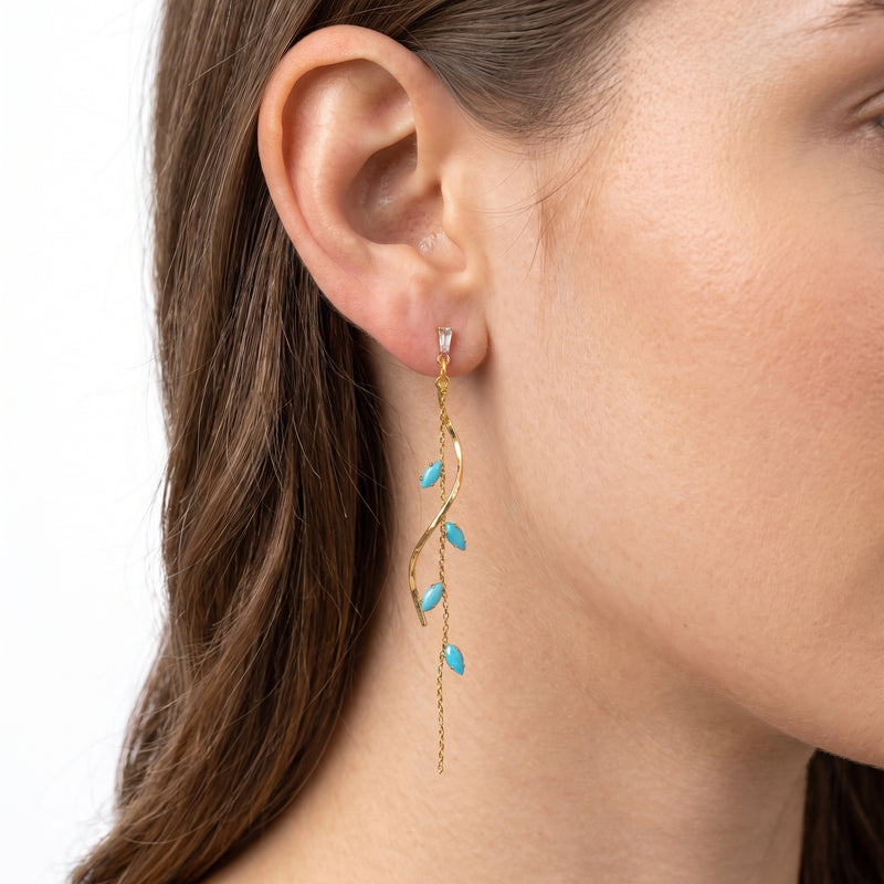 Close-up of the Lelice Santorini Turquoise Drops in gold on the ear