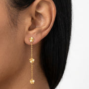 Close-up of the Lelice Senna Floral Earrings in gold on the ear