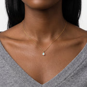 Close-up of the Lelice Seraphina Opal Necklace in gold at the collarbone