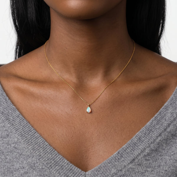 Close-up of the Lelice Seraphina Opal Necklace in gold at the collarbone