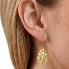 Close-up of the Lelice Sienna Drop Earrings in gold on the ear