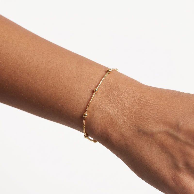 Close-up of the Lelice Sierra Canyon Bracelet in gold on the wrist