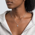 Woman turned three-quarters wearing the Slow & Steady Silver Necklace