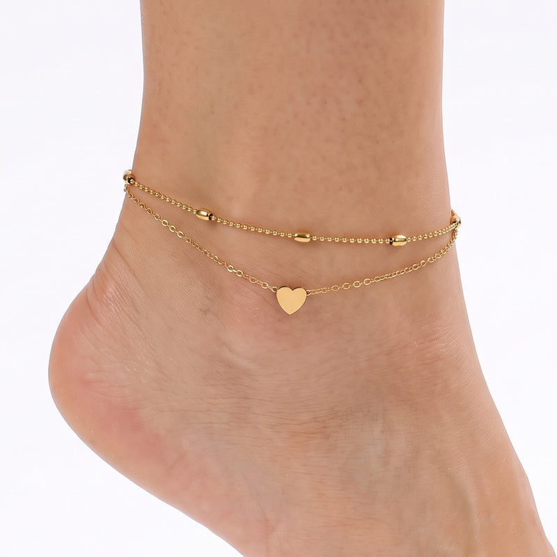 Ankle wearing Lelice gold layered heart anklet Paris
