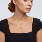 Neckline profile with hair up, wearing the Soleil Gold Sunflower Pendant Necklace