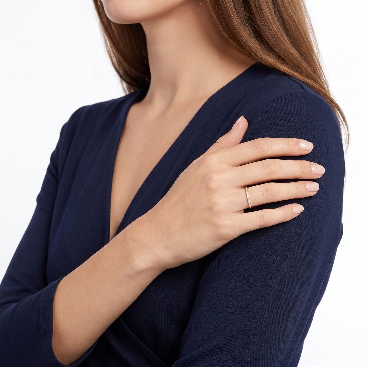 Arm folded across the body wearing Solène gold pavé ring