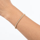 Close-up of the Lelice Sophie Tennis Bracelet in gold on the wrist