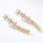 Lelice Stella Gold Flower and Star Crystal Ear Climbers on a white background