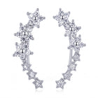 Lelice Stella Silver Flower and Star Crystal Ear Climbers on a white background