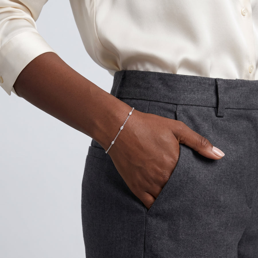 Model wearing the Lelice Sylvie Silver Bracelet, hand in the trouser pocket