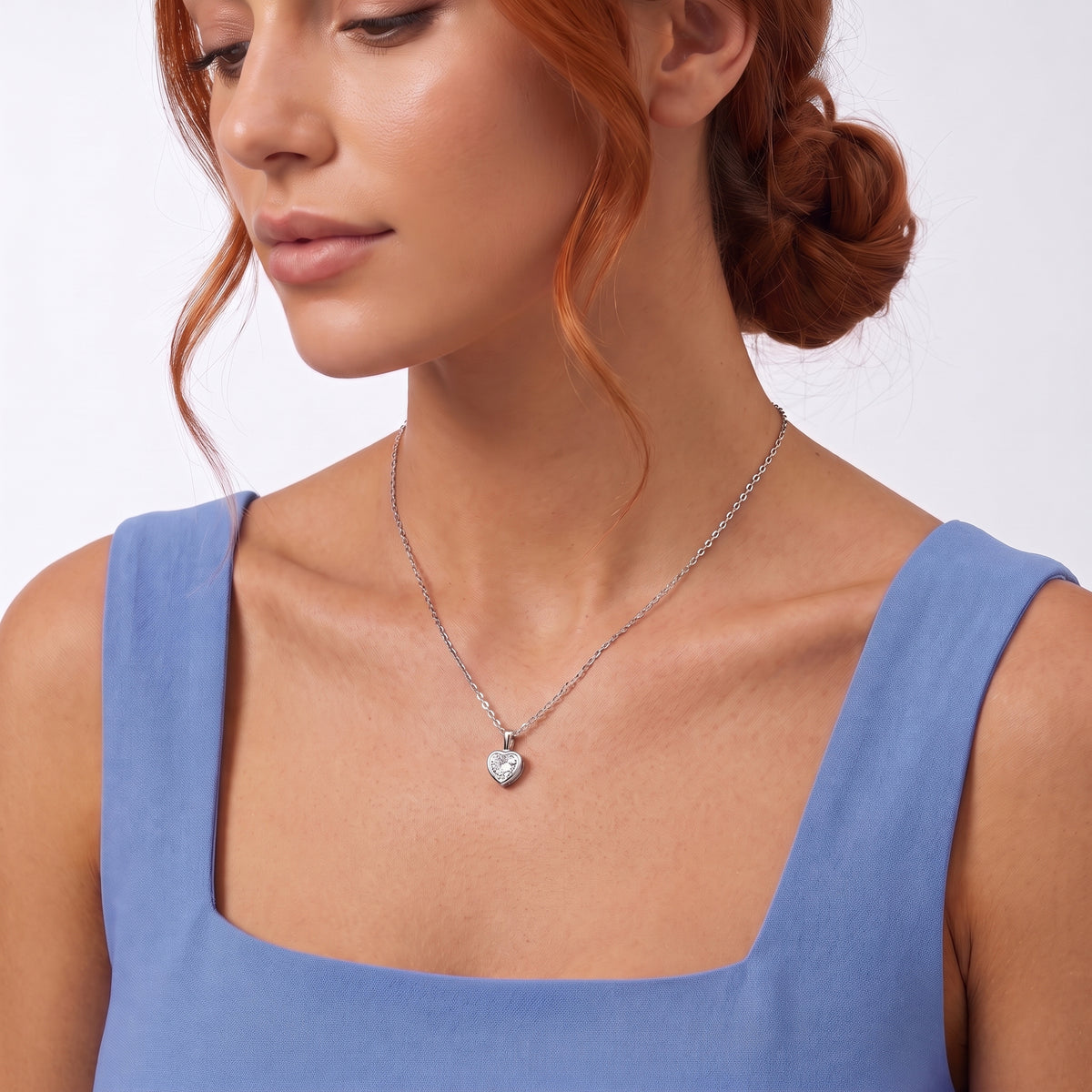 Neckline profile with hair up, wearing the Sylvie Silver Necklace