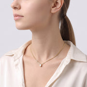 Side profile of the neckline with the Teardrop Bezel Necklace