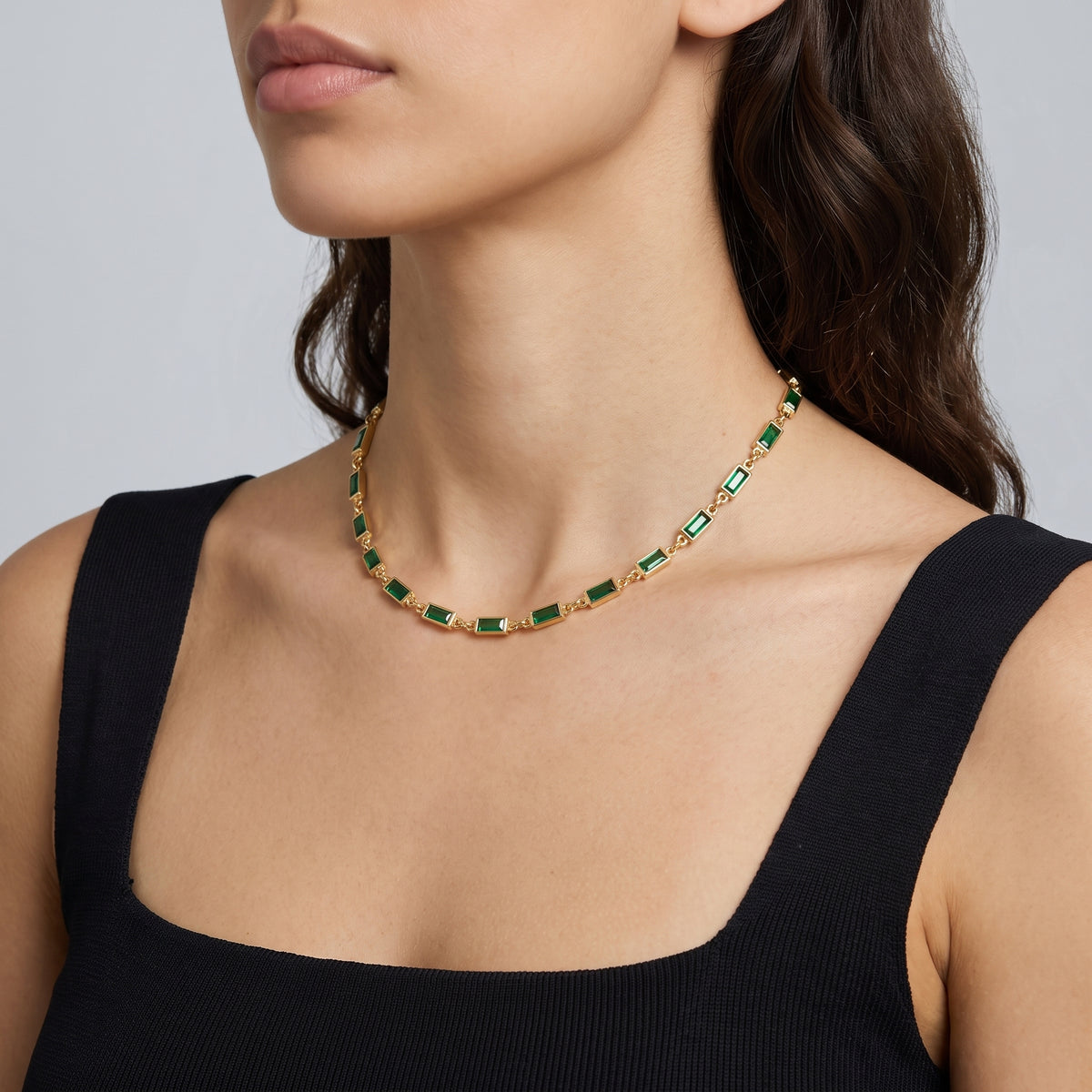 Side profile of the neckline with the Deco Emerald Choker