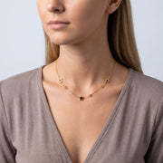 Shoulders and neckline of a woman wearing the Stardust Choker