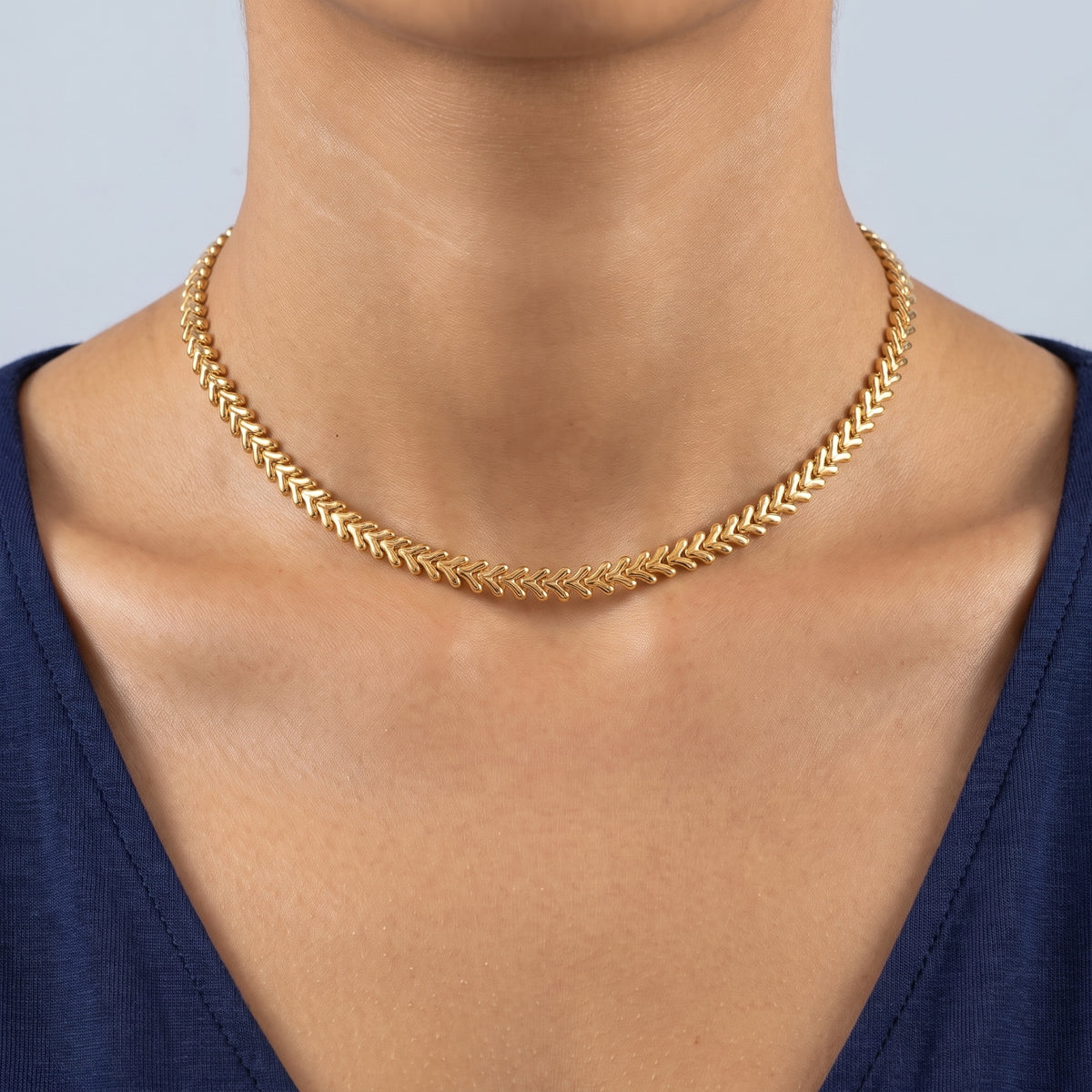 Close-up of the V-Link Choker resting on the skin