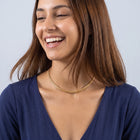 Laughing woman wearing the V-Link Choker