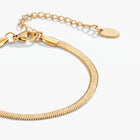 Lelice Vera Coil Bracelet in gold on a white background