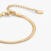 Lelice Vera Coil Bracelet in gold on a white background