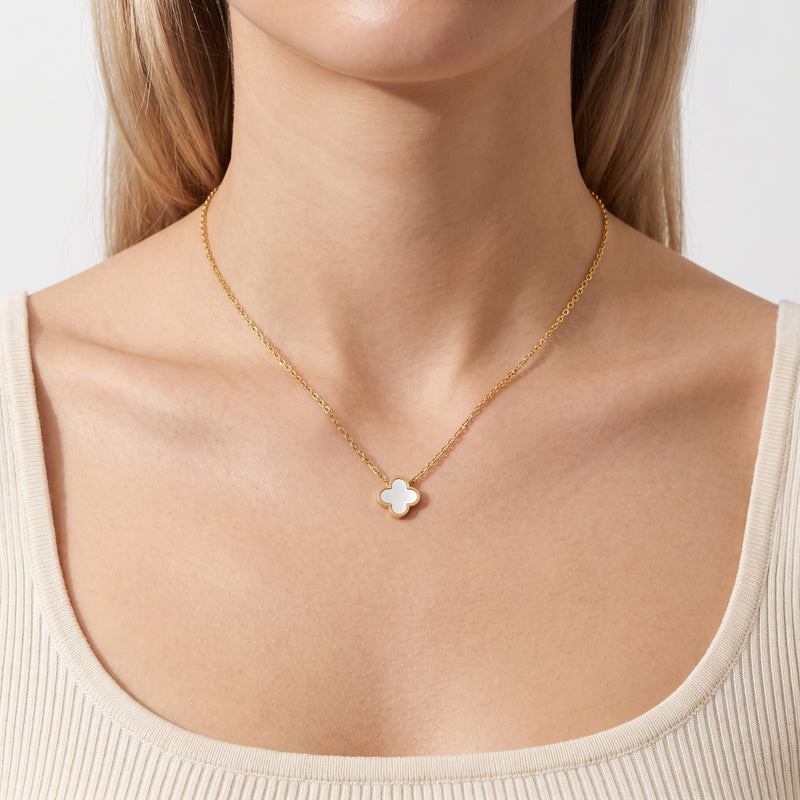 Close-up of the Lelice Verona Clover Pendant in gold at the collarbone
