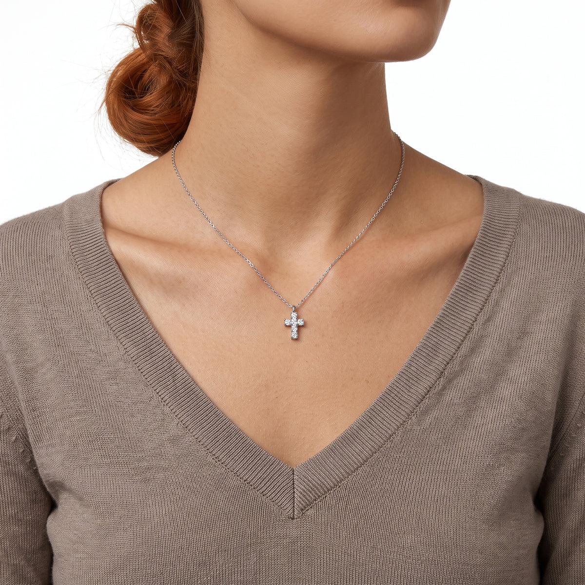 Close-up of the Lelice Zara Cross Necklace in silver at the collarbone