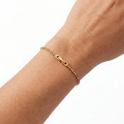 Close-up of the Lelice Zoé Peridot Bracelet in gold on the wrist